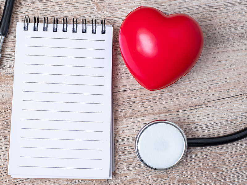 Photo of notepad and stethoscope for UArizona Health Screening