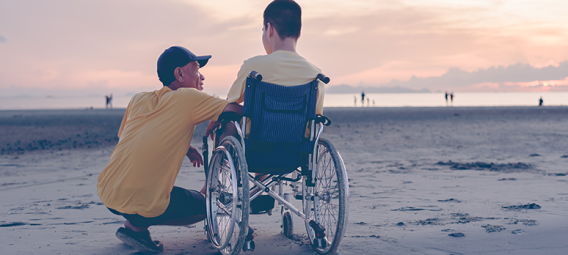  Licensed FILE #:  507344483  Preview Crop  Find Similar DIMENSIONS 5916 x 3320px FILE TYPE JPEG CATEGORY People LICENSE TYPE Education License Behind of father or volunteer or caregiver talking to young man with disability on the sea beach at sunset,