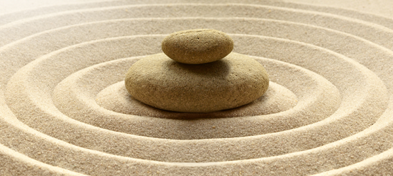 zen garden meditation stone background with stones and lines in sand for relaxation balance and harmony spirituality 
