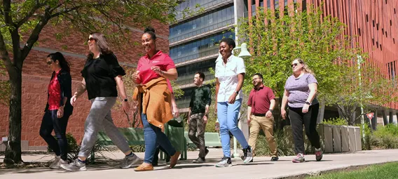 Members of the Health Sciences Research Administration’s Walkie Talkie teams walk regularly during lunch. There are four Walkie Talkie teams with a total of 26 members.