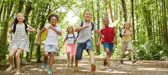 Group of kids with backpack makes a race