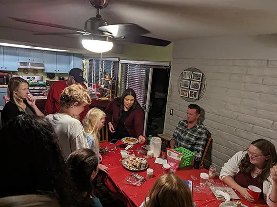 Wellness Ambassadors from EMSC building gingerbread houses before winter break.