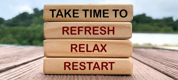 Take time to refresh, relax and restart text on wooden blocks with nature and park background.