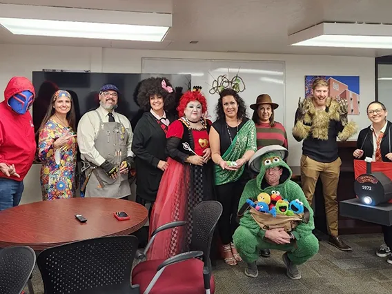 colleagues in financial aid dept dressed up for Halloween