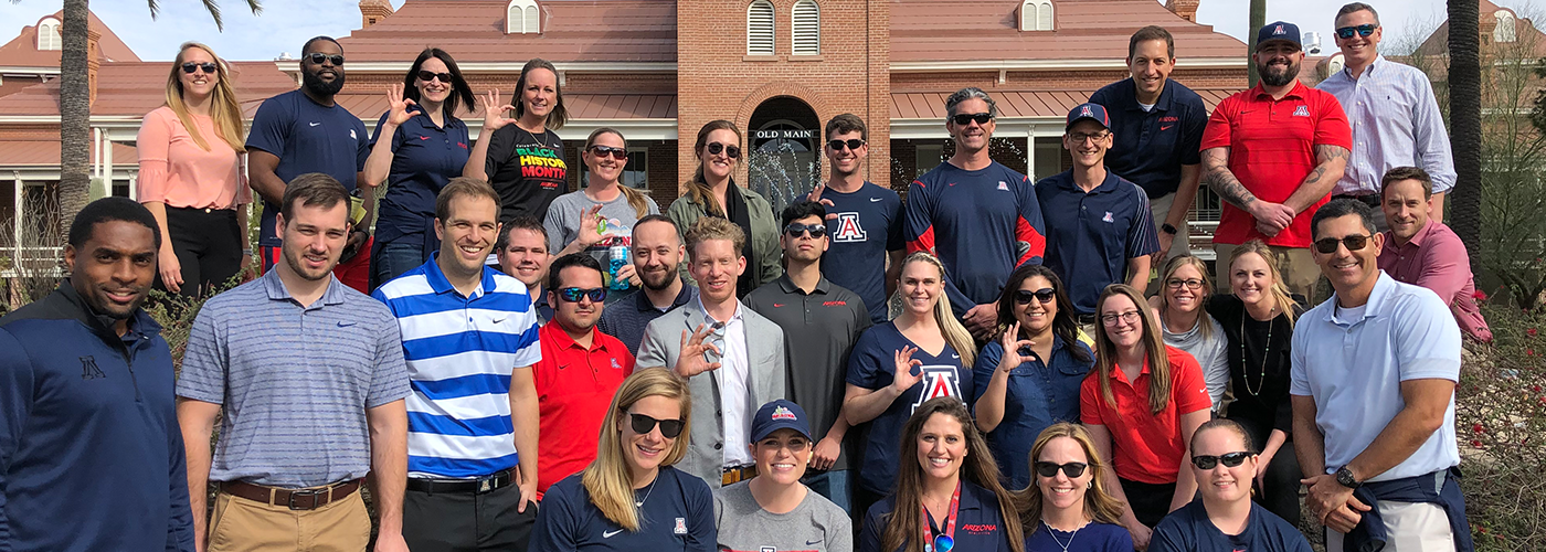 A group of University of Arizona employees posing for a picture after a walk.
