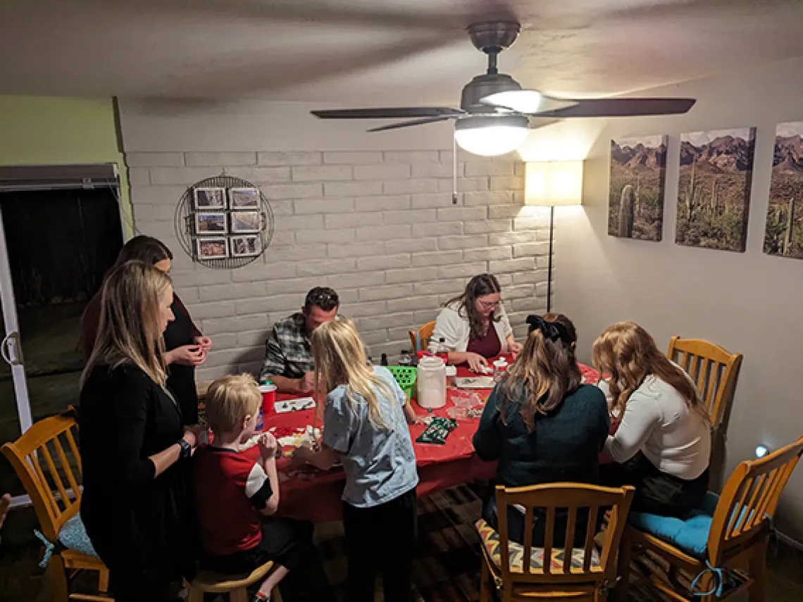 Wellness Ambassadors from EMSC building gingerbread houses before winter break.