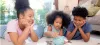 African-American children saving money in piggy bank for planning future financial success